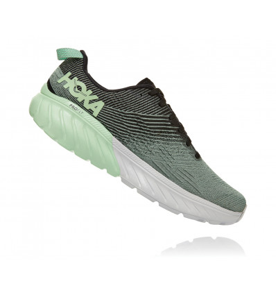 green and black running shoes